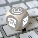 Standardbild für Ansprechpartner ohne Foto Würfel mit Kontaktmöglichkeiten auf Tastatur
